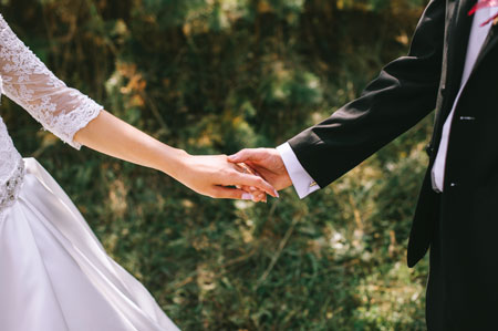 Married Couple Holding Hands - Prenuptial Agreements